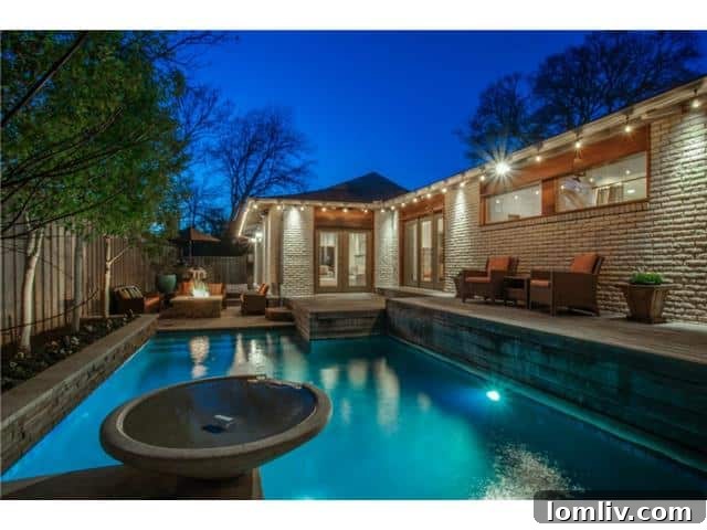 Resort-Style Backyard with Pool and Waterfall in Dallas Home