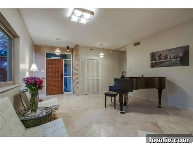 Elegant Foyer with Travertine Flooring in Dallas Home
