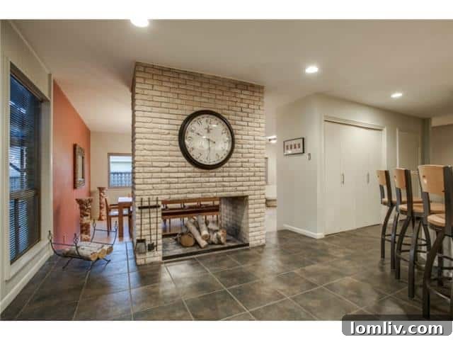 Iconic See-Through Fireplace Separating Dining and Kitchen