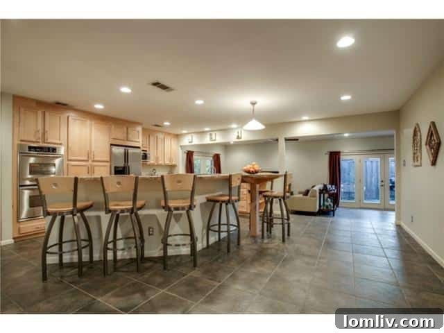 Gourmet Kitchen Opening to Family Room with Backyard Views