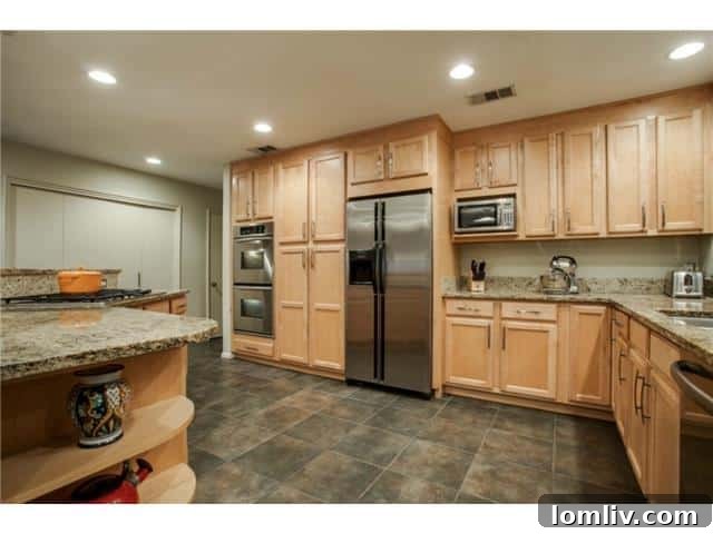 Luxurious Modern Kitchen with Granite and Stainless Steel Appliances