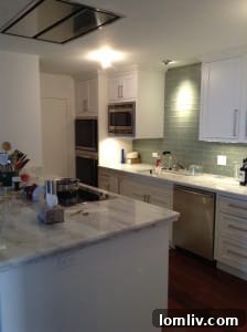 Elevating Your High-Rise Renovation: The Role of Architects and Designers 4 A transformed, modern kitchen in a high-rise condo, showcasing the successful 'after' renovation.