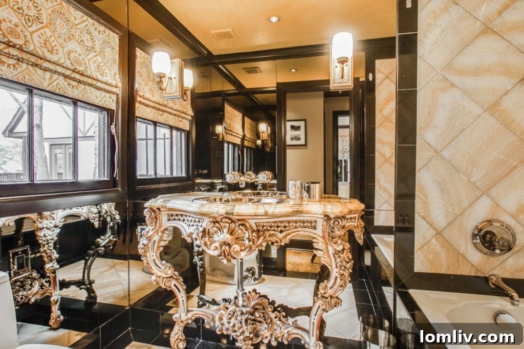 The elegant second bathroom featuring an antique French console vanity with a marble slab countertop and stylish fixtures.