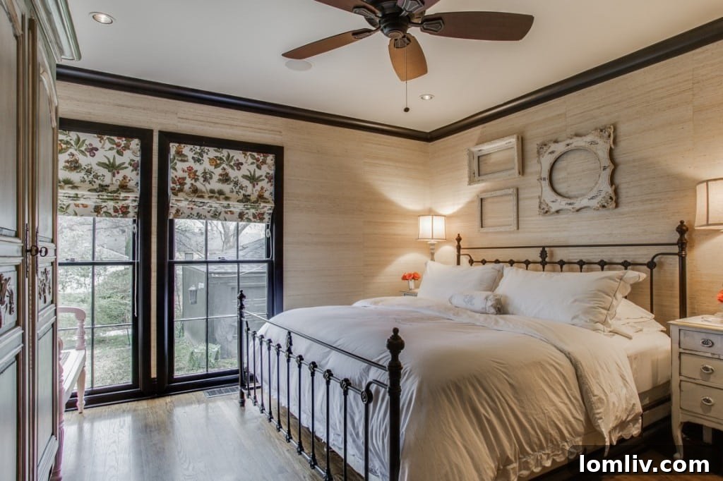 A serene master bedroom with ample natural light, soft color palette, and elegant window treatments, leading to an ensuite.