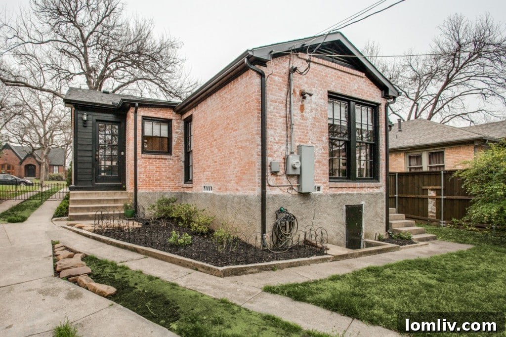 A closer look at the home's exterior, showcasing the brick facade and well-maintained windows.
