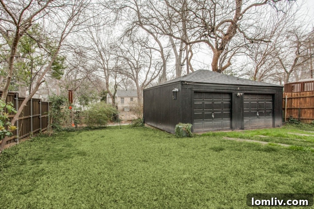 Another view of the home's charming exterior, highlighting its architectural details and well-kept garden beds.