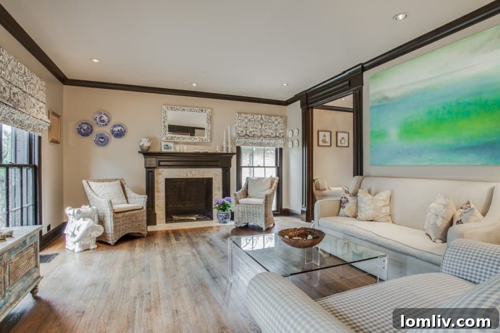 The inviting living room of 6918 Patricia Ave, featuring hardwood floors, ample natural light, and tasteful decor.