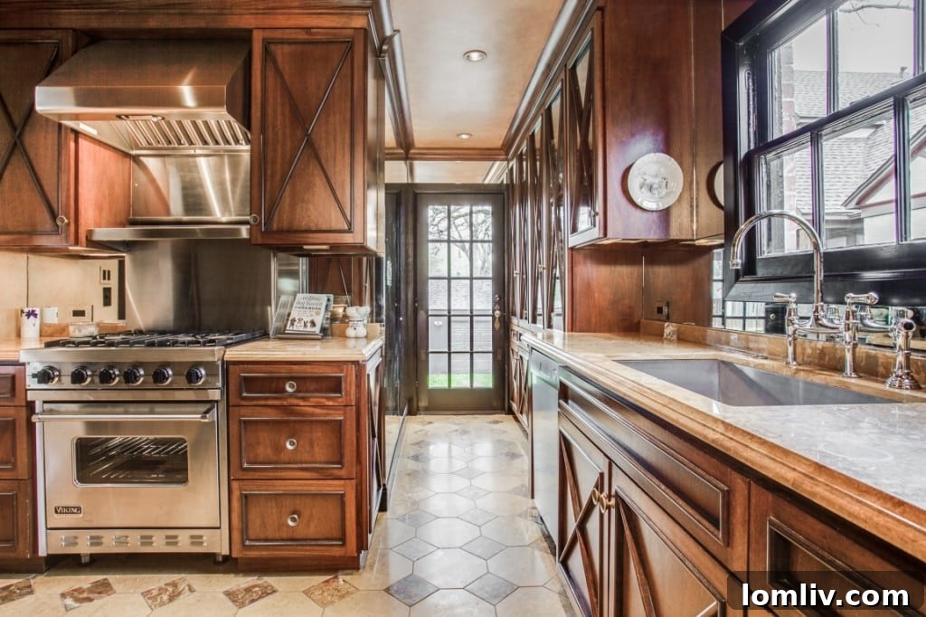 A close-up of the kitchen showcasing the Viking range and Sub-Zero refrigerator, integrated into custom cabinetry.