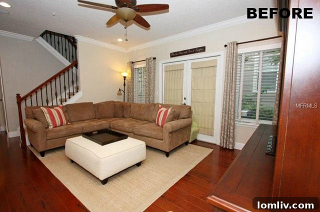 Before professional lighting: A dimly lit living room appearing small and uninviting, lacking proper exposure and vibrant colors.