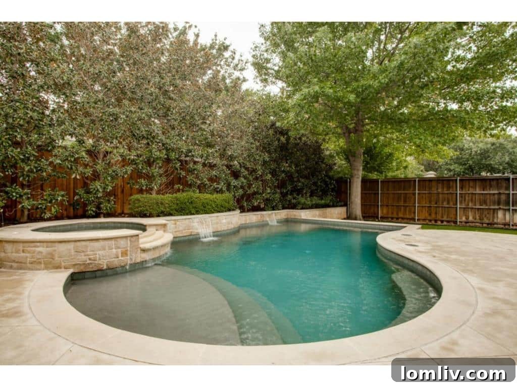 A closer view of the private swimming pool at 4436 Brookview, complete with a tanning ledge for ultimate relaxation.