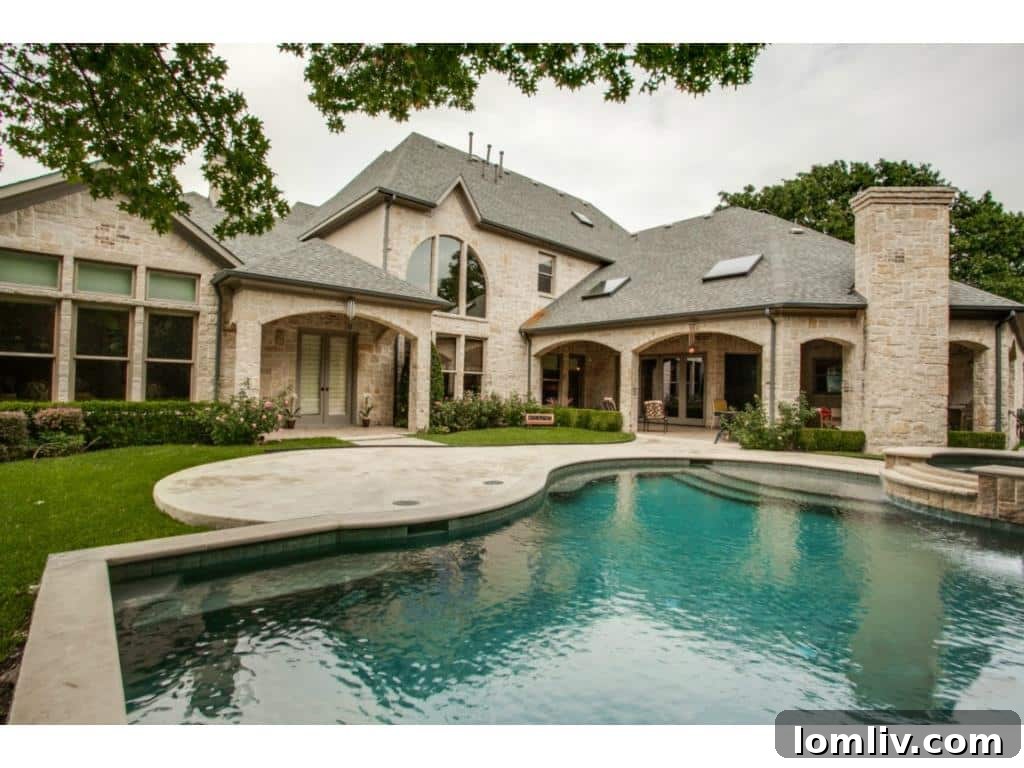 The impressive rear view of the 4436 Brookview estate, highlighting the expansive grounds and architectural beauty from the back.