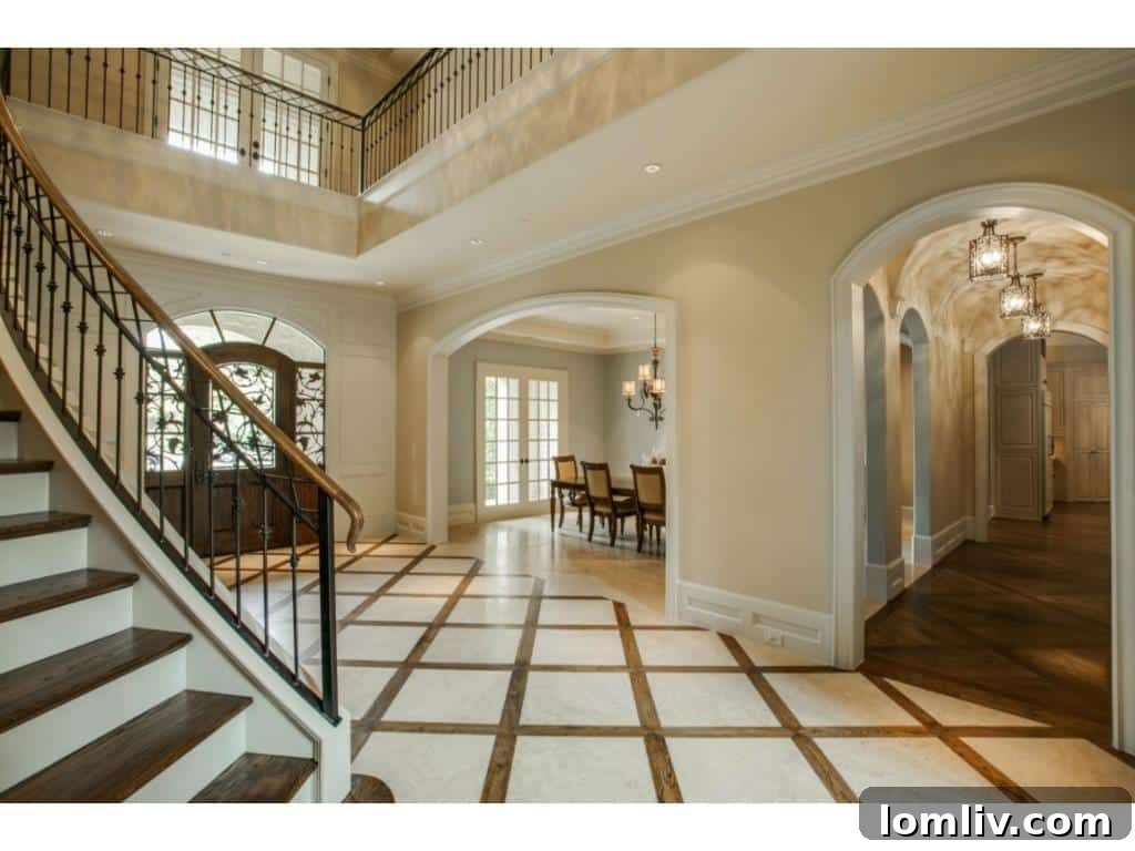 The impressive foyer of the 4436 Brookview estate, showcasing a stunning groin ceiling and elegant architectural details.