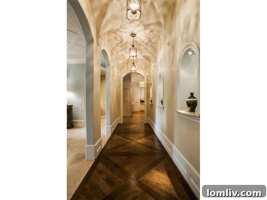 A beautifully designed hallway within the 4436 Brookview luxury home, featuring refined finishes and architectural arches.