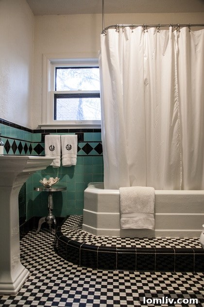The preserved vintage full bath in Emily Larkin's Hollywood Heights home, a testament to thoughtful renovation that maintains historic appeal.