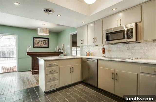 Globe pendant light illuminating the kitchen island