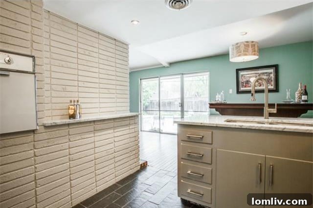 Kitchen view showing the sleek design and abundant counter space