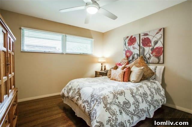 Third bedroom, featuring the home's consistent hardwood flooring