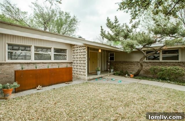 Front facade of the Dallas midcentury home with geometric details