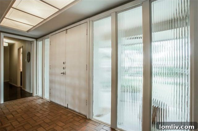 Bright and private entryway with obscure glass panels