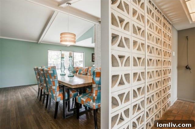 Spacious dining room with a grand wood-burning fireplace and vaulted ceilings