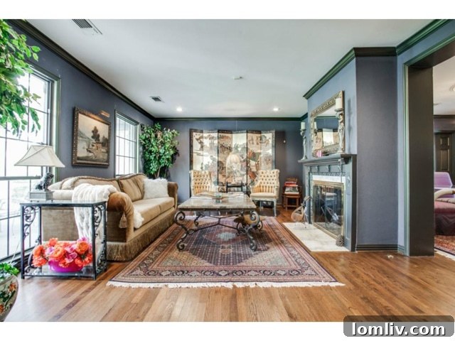 Formal Living Room with Elegant Fireplace at 6701 Inwood
