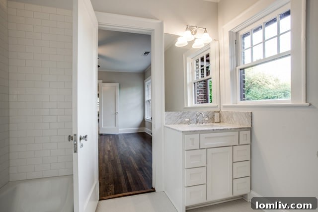Another charming secondary bedroom at 5803 Swiss Avenue, showcasing natural light and potential for personalization