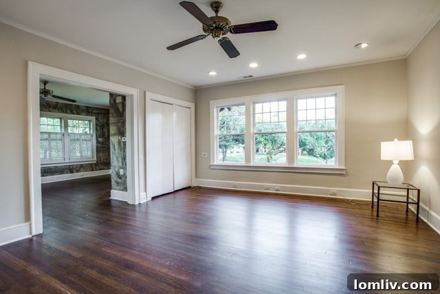 Spacious master bedroom in the historic 5803 Swiss Avenue residence, offering ample light and a comfortable ambiance