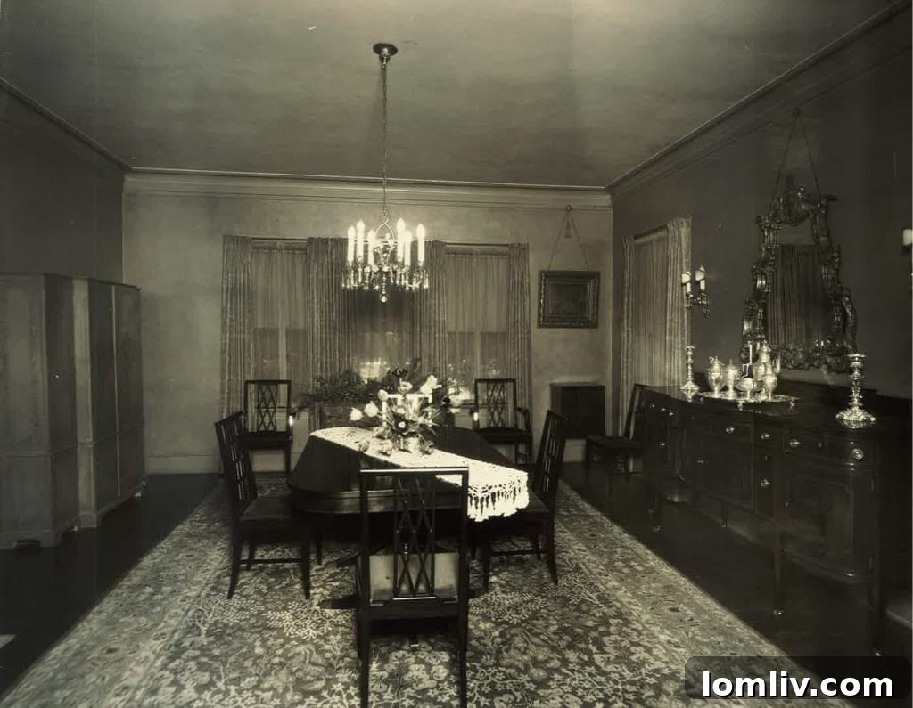 Historic photo of the Carrie Marcus House dining room, featuring its original chandelier now located in the neighboring home