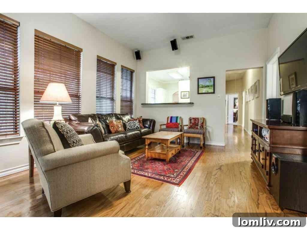 Another view of the den, showing its warm ambiance and versatility as a living space.