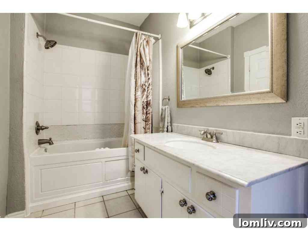 Luxurious master bathroom featuring a deep soaking jacuzzi tub, creating a spa-like experience.