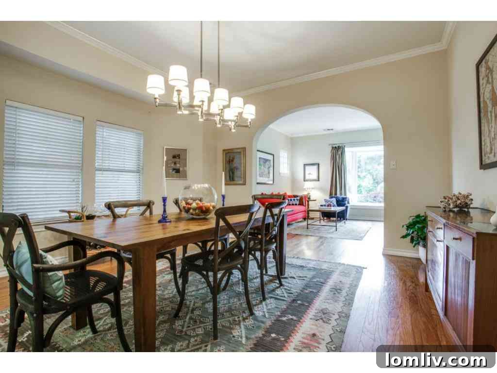 Elegant dining room with original hardwood floors and classic decor, perfect for entertaining.