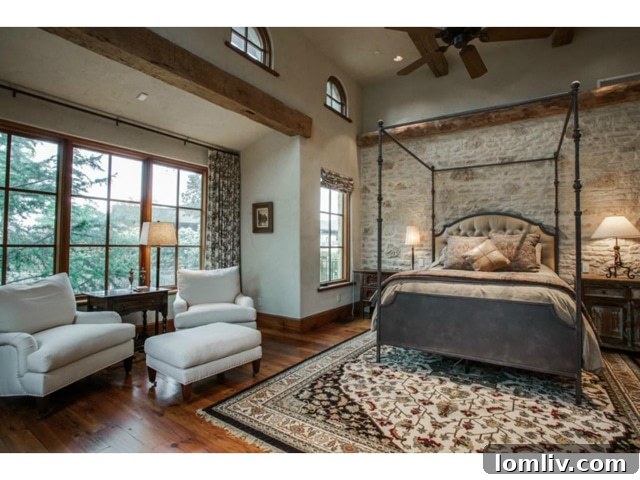 Primary master bedroom with luxurious finishes and comfortable seating