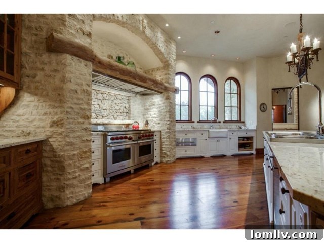 Second view of commercial-grade kitchen with abundant counter space and storage
