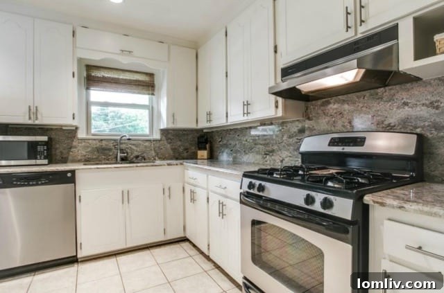 Detail of the kitchen's ample storage and stainless steel appliances