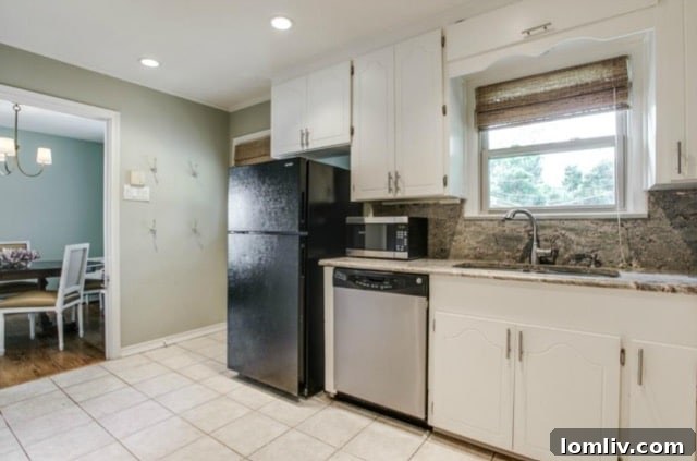 The beautifully updated kitchen with new hardware and lighting