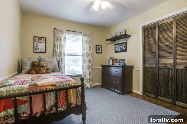 Children's bedroom featuring Ralph Lauren map wallpaper and FLOR modular carpet tiles