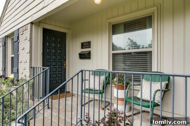 The inviting front entrance and charming porch after renovation