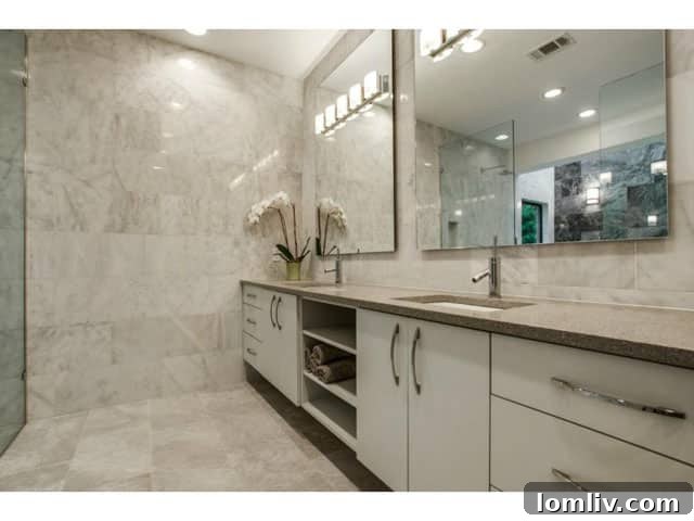 Soft Contemporary Perfection: Your Ultimate Escape from the Suburbs 16 Elegant Master Bathroom with Double Vanity and Mirror Lighting