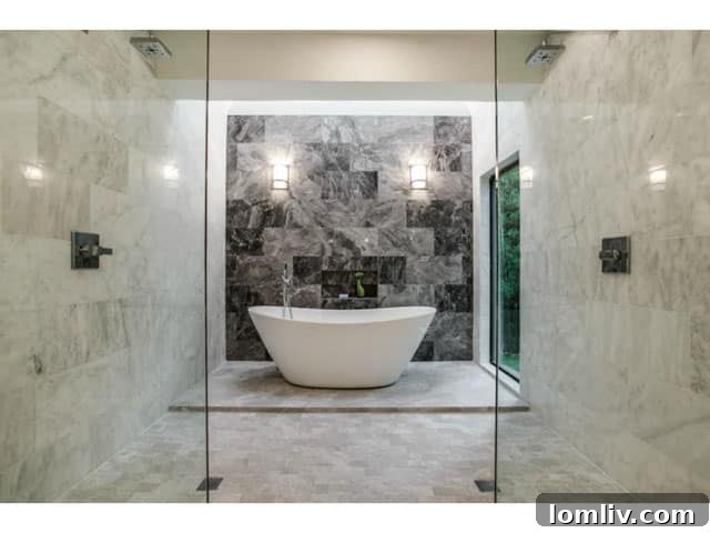 Soft Contemporary Perfection: Your Ultimate Escape from the Suburbs 17 Spa-like Master Bath featuring a Wet Area with Double Shower and Freestanding Tub