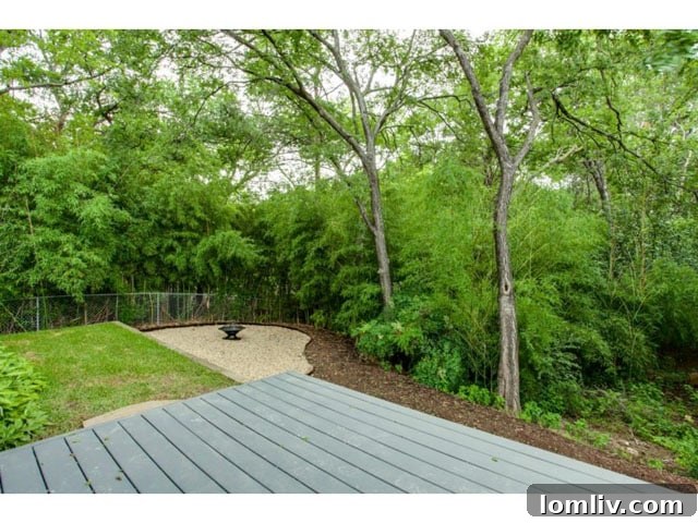 Soft Contemporary Perfection: Your Ultimate Escape from the Suburbs 19 Private Backyard with Wooded Creek View and Lush Landscaping