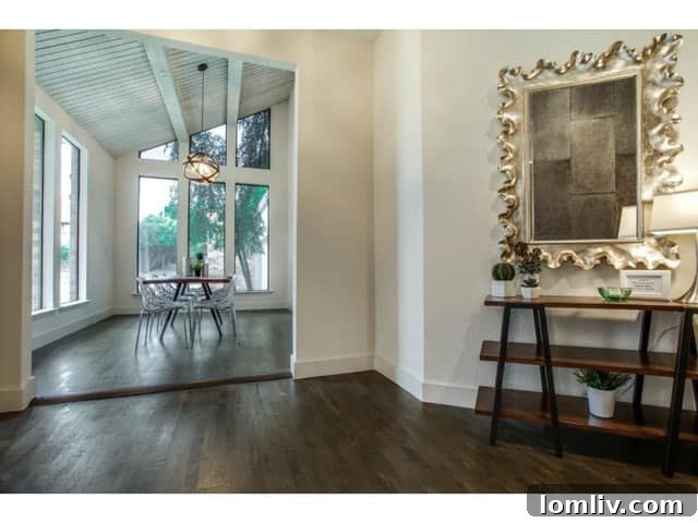 Soft Contemporary Perfection: Your Ultimate Escape from the Suburbs 3 Grand Entryway of 6201 Twin Oaks Circle with high ceilings and natural light