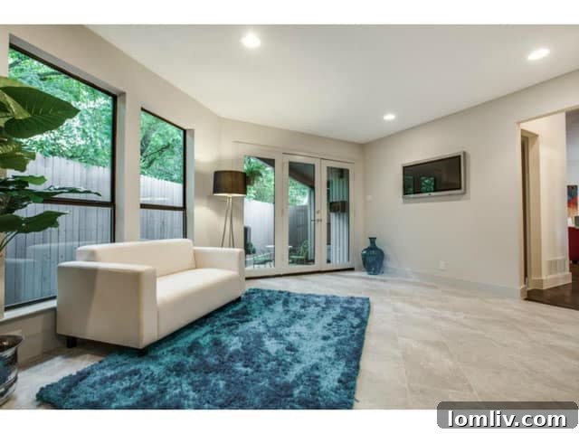 Soft Contemporary Perfection: Your Ultimate Escape from the Suburbs 9 Comfortable Living Area Adjacent to Kitchen with Outdoor Grilling Patio Access
