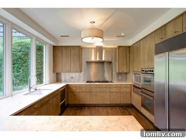 State-of-the-art gourmet kitchen with professional-grade stainless steel appliances and stone counters.