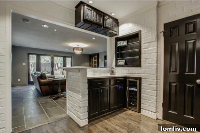 Spacious kitchen island providing ample counter space and seating, ideal for casual dining at 5824 Palm Ln
