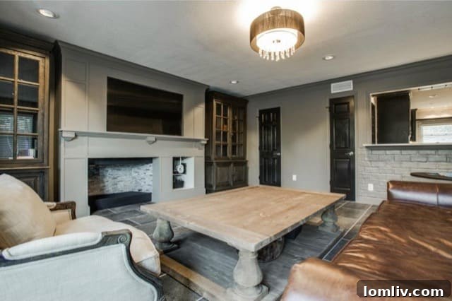 View of the sophisticated bar area with wine fridge connecting to the second living space at 5824 Palm Ln