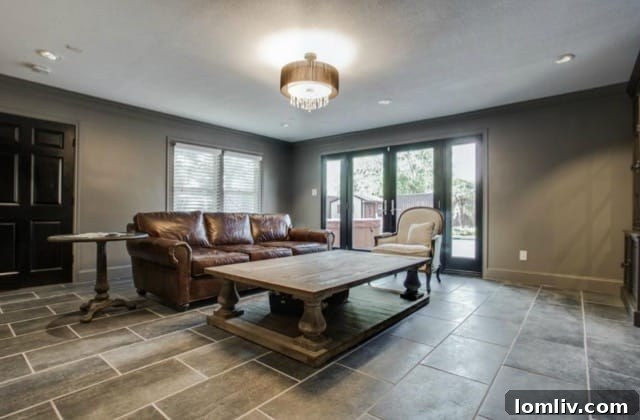 Open concept design between the kitchen and secondary living area, perfect for social gatherings at 5824 Palm Ln