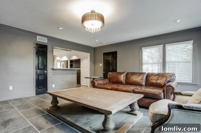 Cozy seating arrangement in the second living area, ideal for relaxation and family time at 5824 Palm Ln