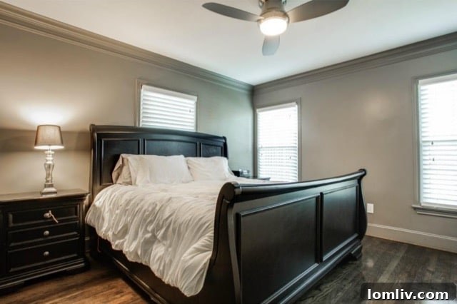 Luxurious master bedroom with gleaming hardwood floors and ample natural light at 5824 Palm Ln