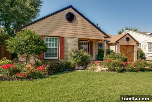 Charming stone walkway and vibrant red roses leading to the front door of 5824 Palm Ln