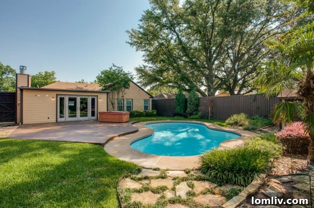 Inviting swimming pool and expansive outdoor deck, perfect for summer entertainment at 5824 Palm Ln